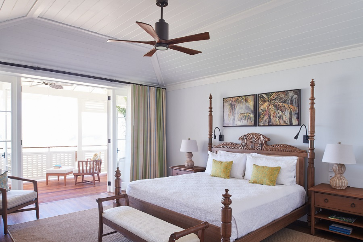 a bedroom with a bed and a ceiling fan