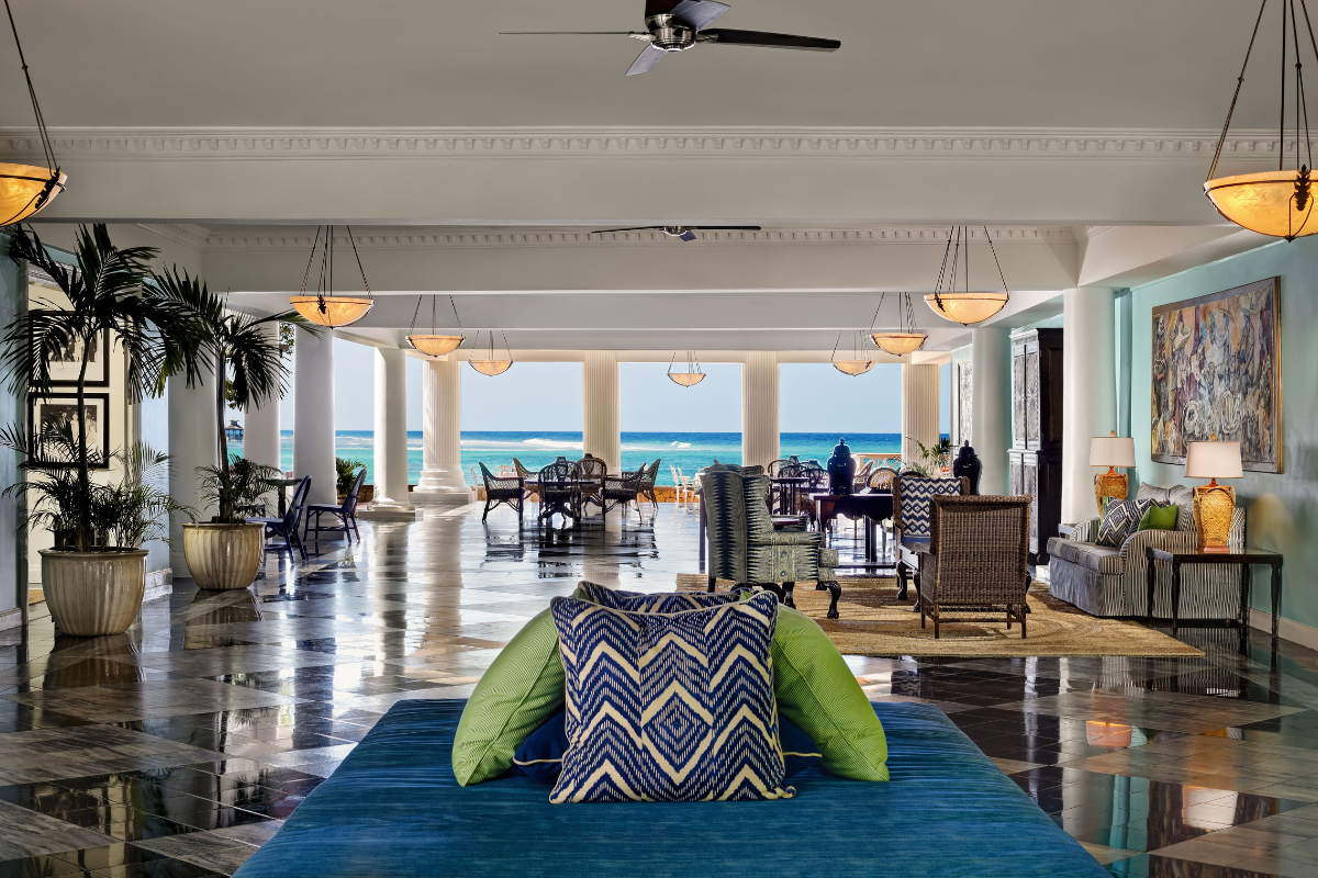 a large room with a large couch and chairs