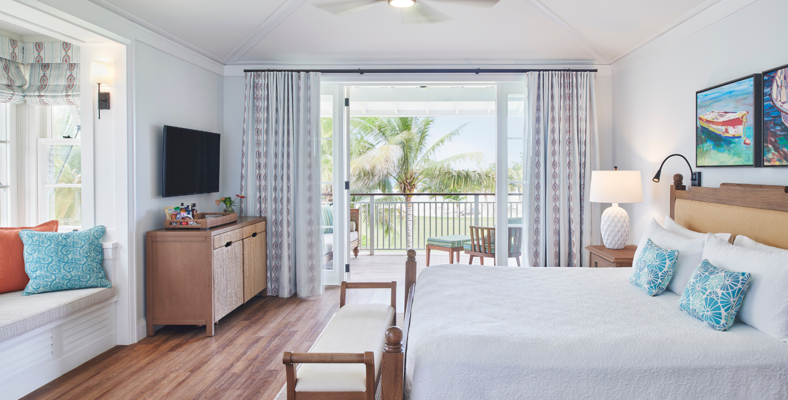 a bedroom with a television and a bed