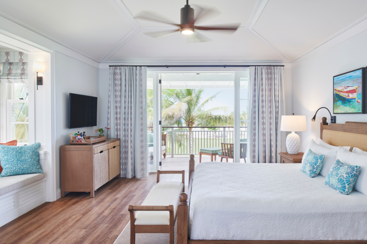 a bedroom with a bed and a television