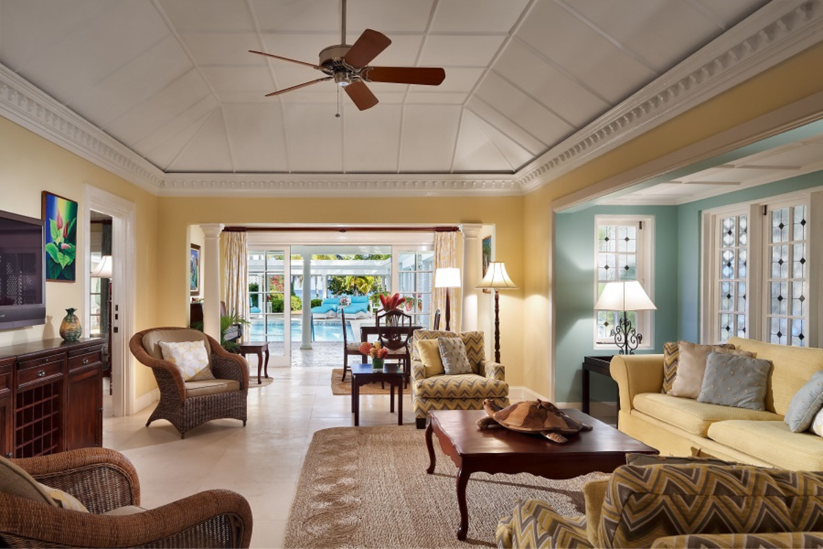 a living room with a fan and furniture