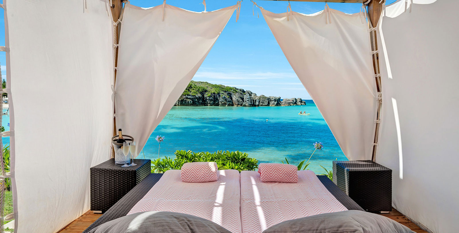 a bed with a view of the ocean