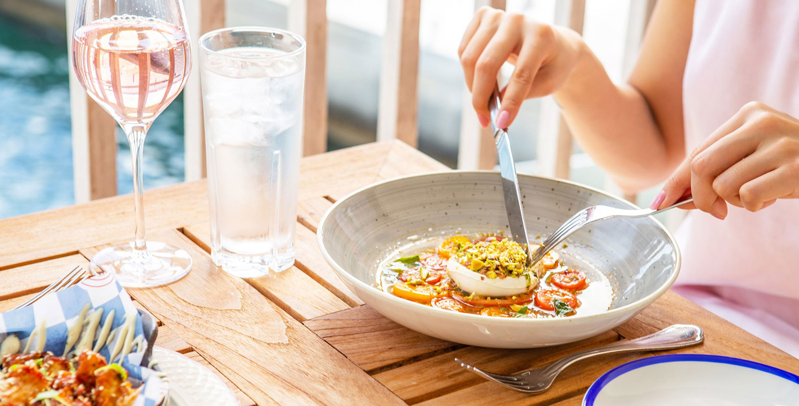 a person eating food in a bowl