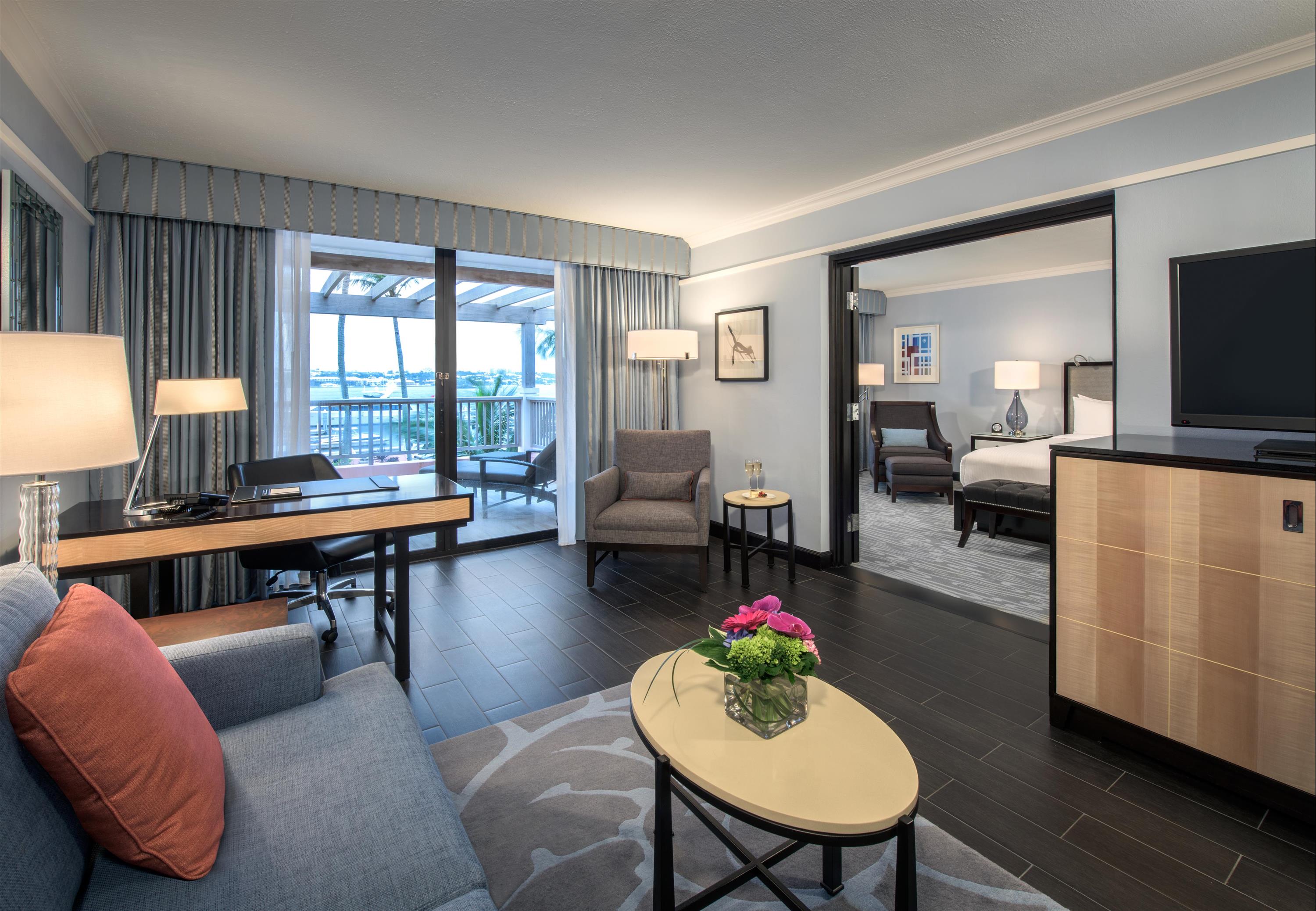 a room with a couch and a desk and a chair