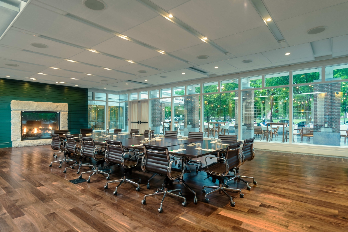 a conference room with a table and chairs