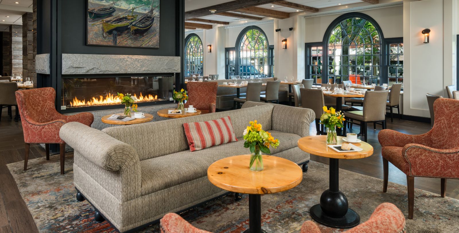 a room with a fireplace and couches