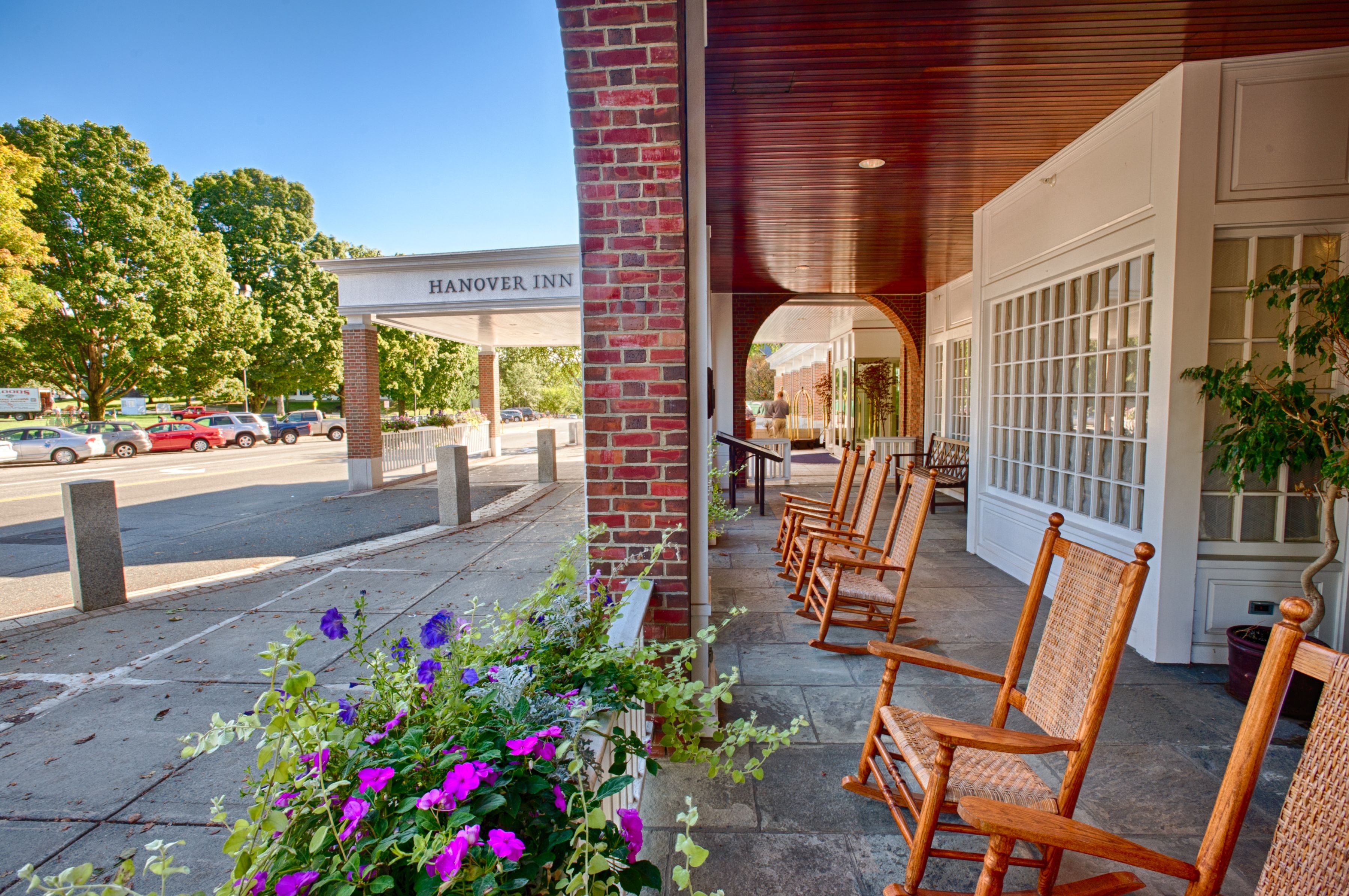 a row of chairs on a porch