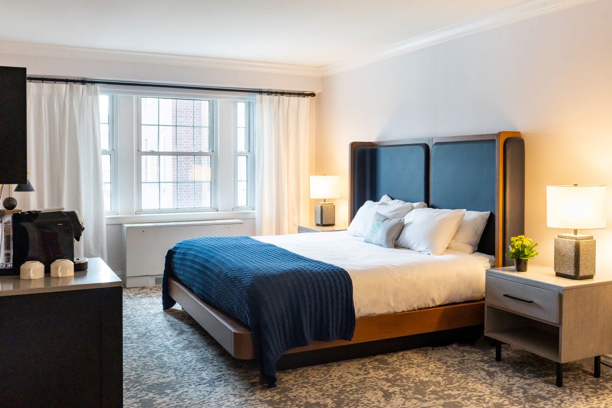 a bedroom with a bed and a dresser