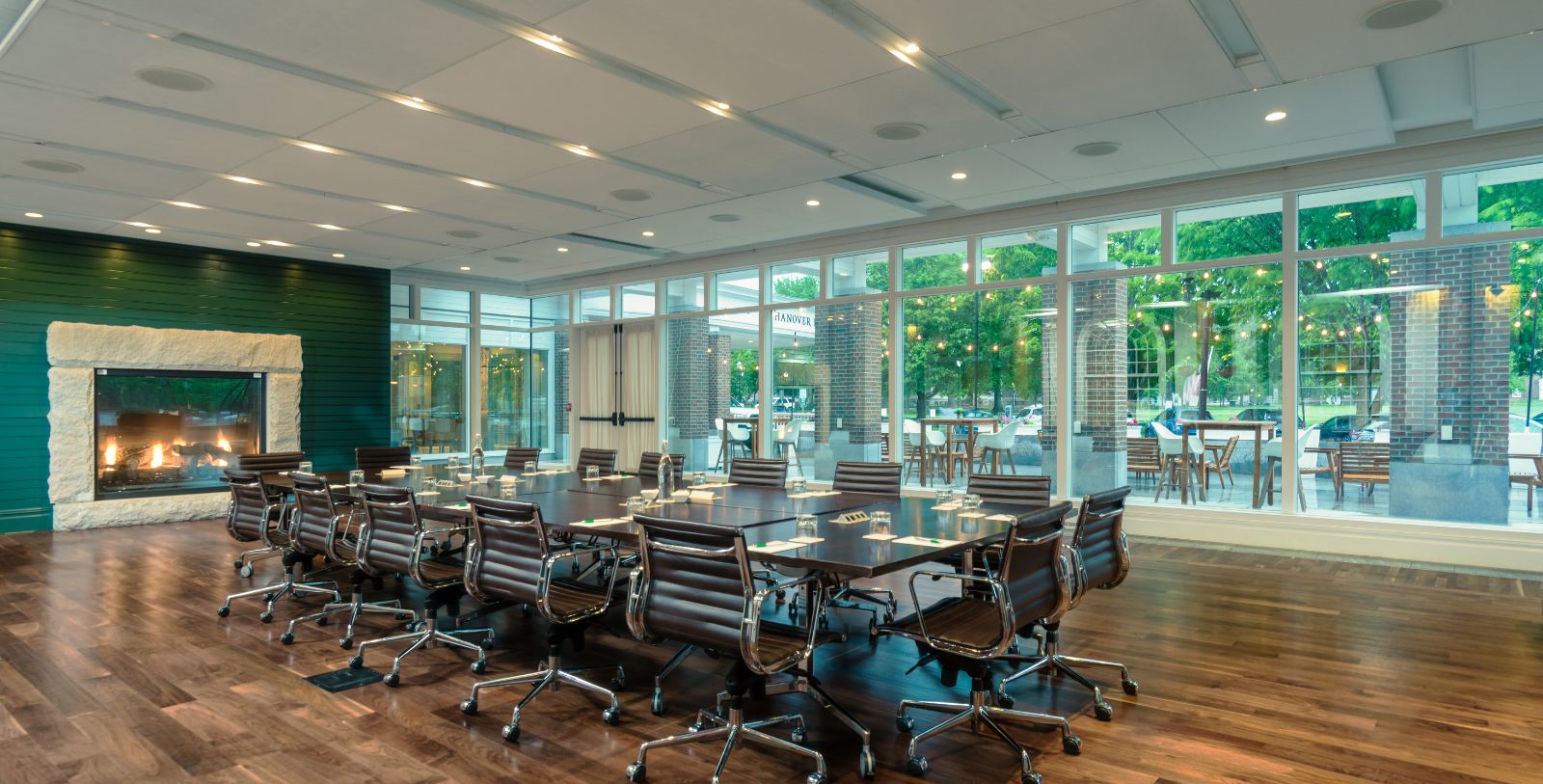 a conference room with a table and chairs