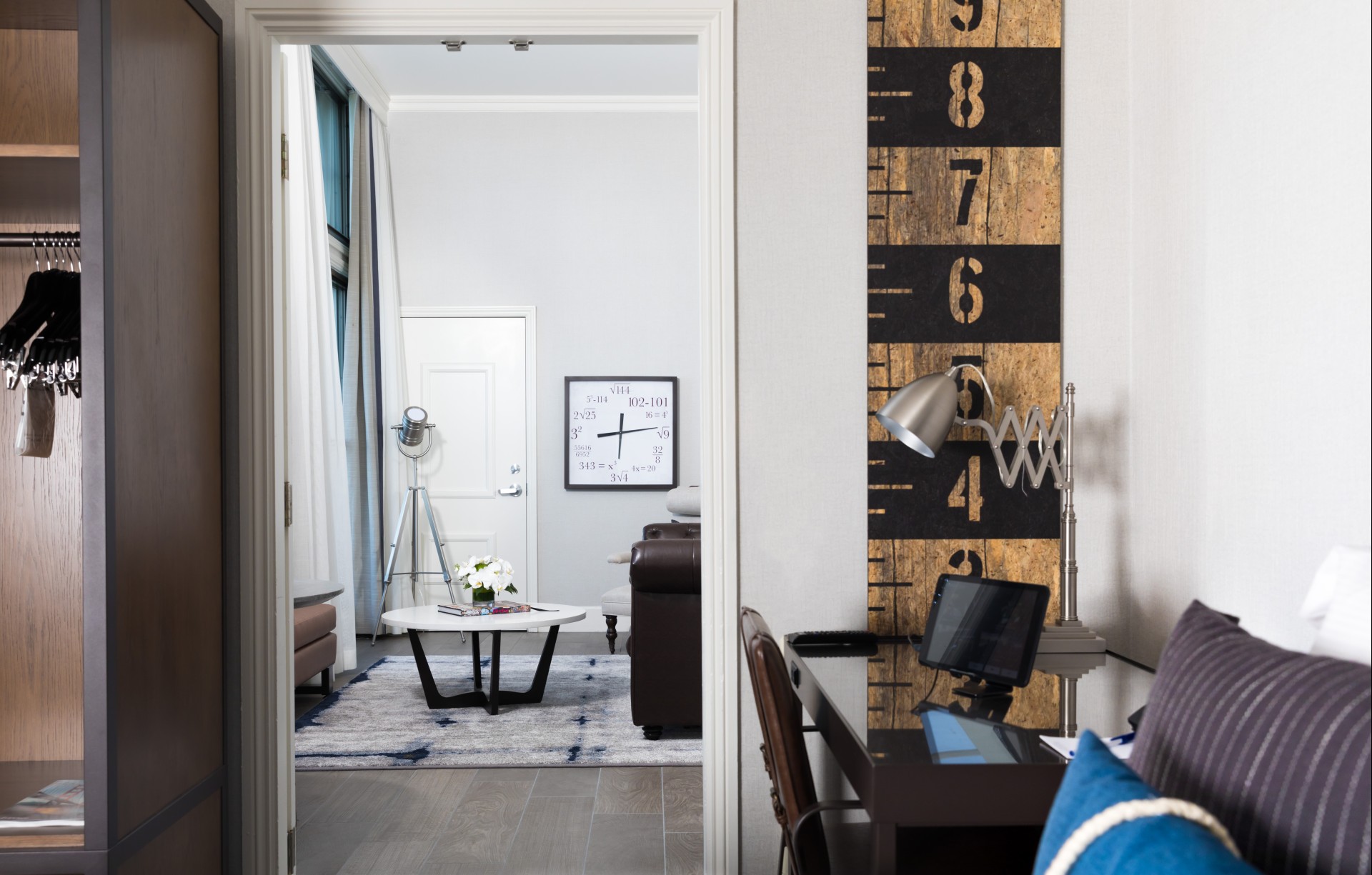 a room with a desk and chair and a table