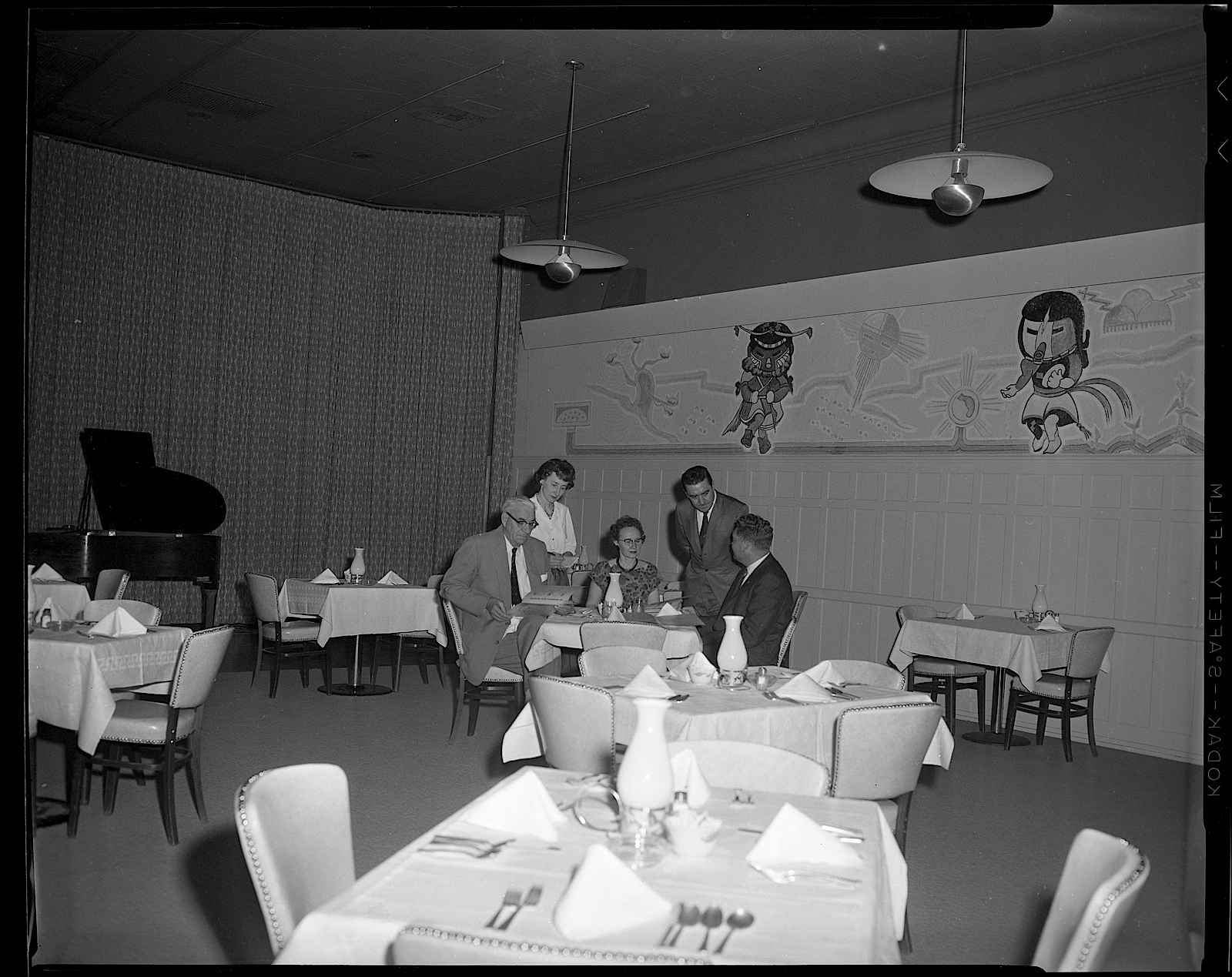 a group of people sitting at tables