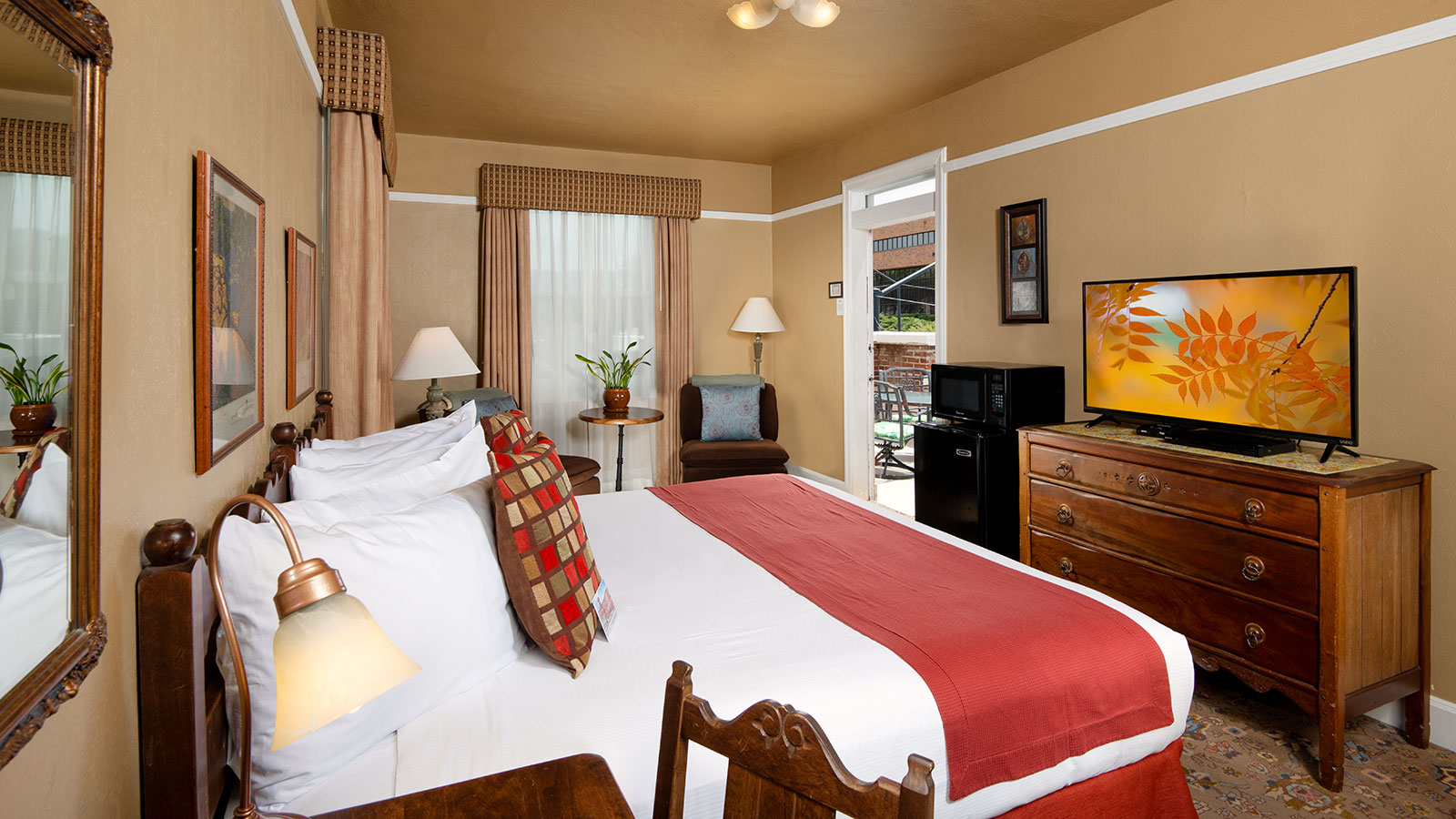 a bedroom with a bed and a television