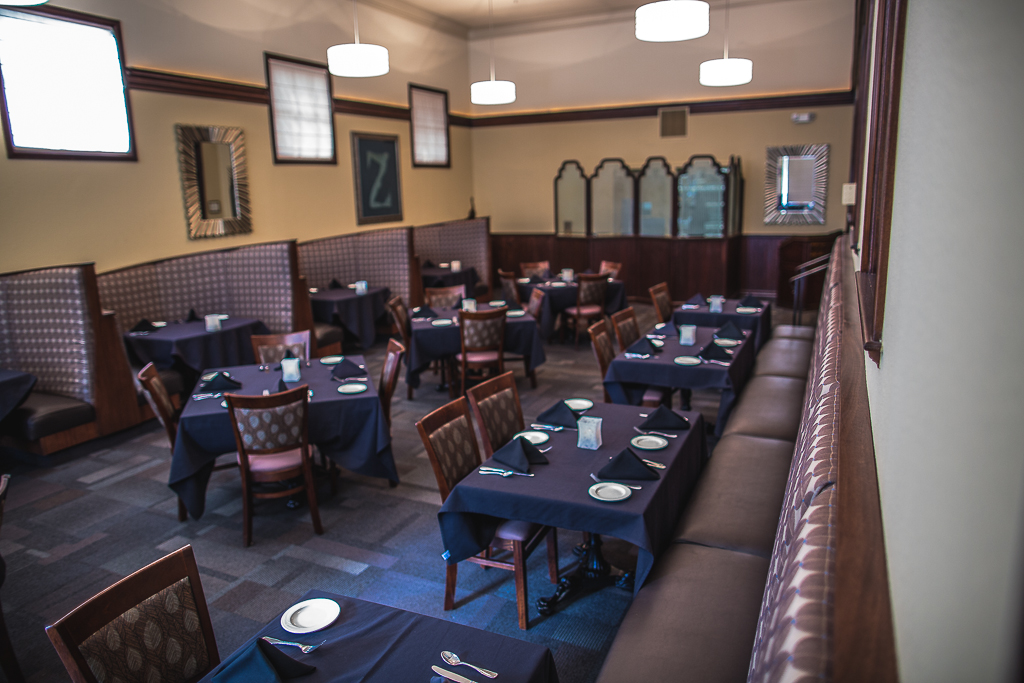 a restaurant with tables and chairs