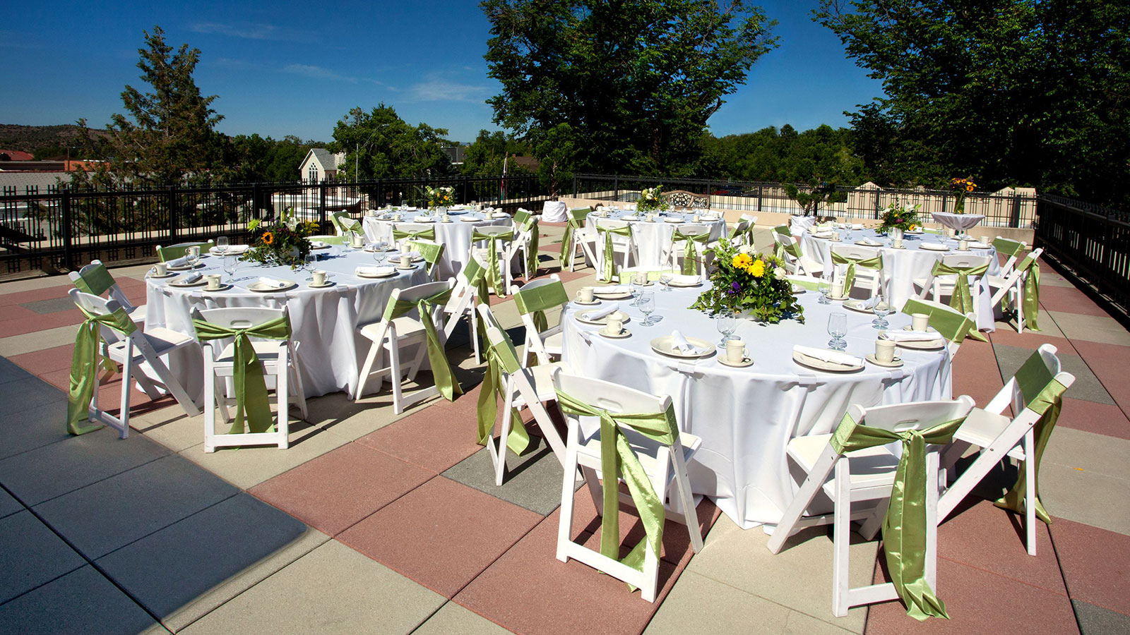 a group of tables set up for a wedding reception
