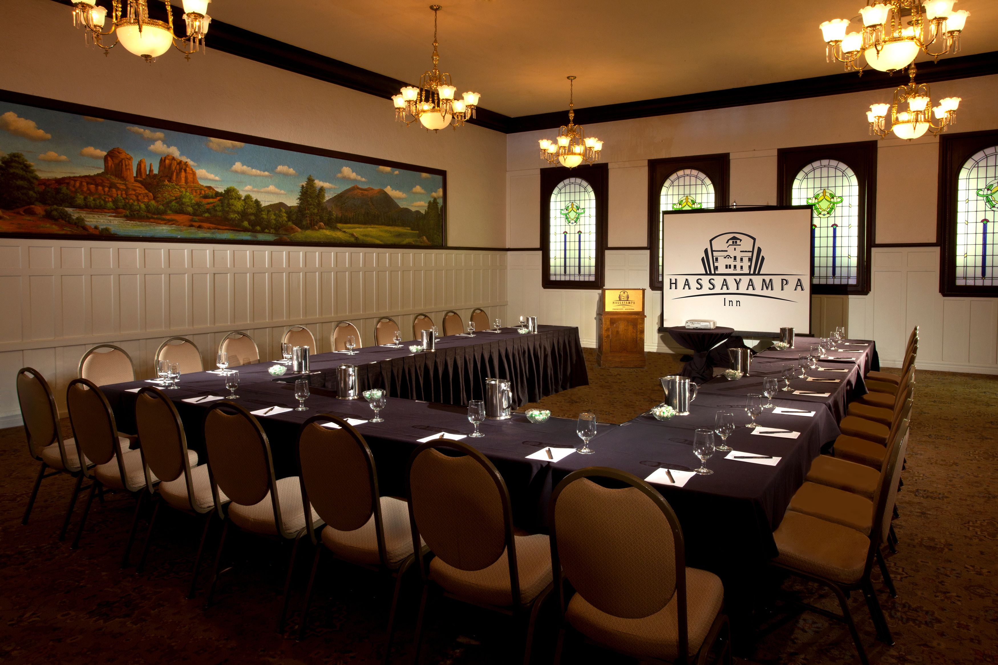 a room with a large table and chairs