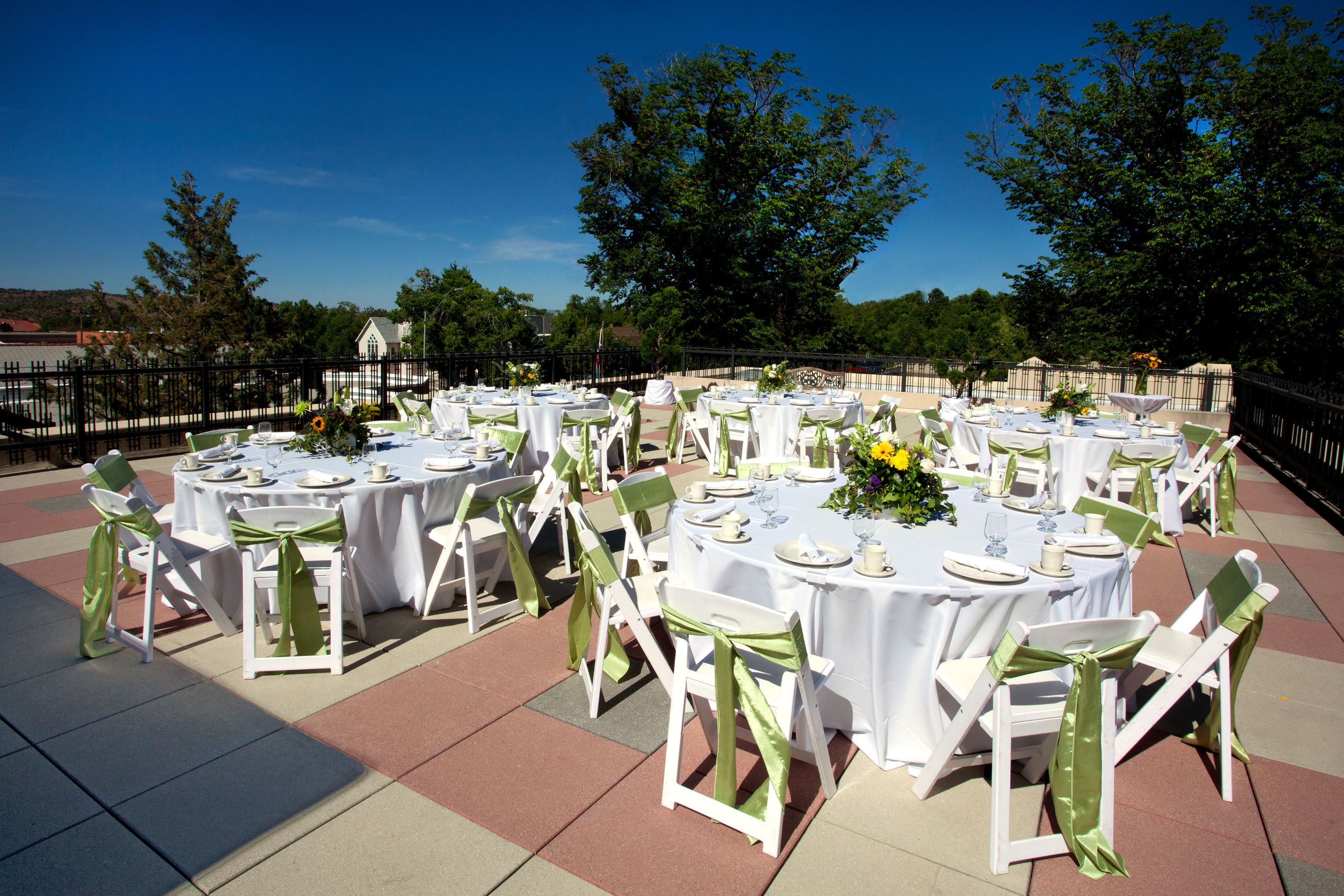 a group of tables set up for a wedding reception