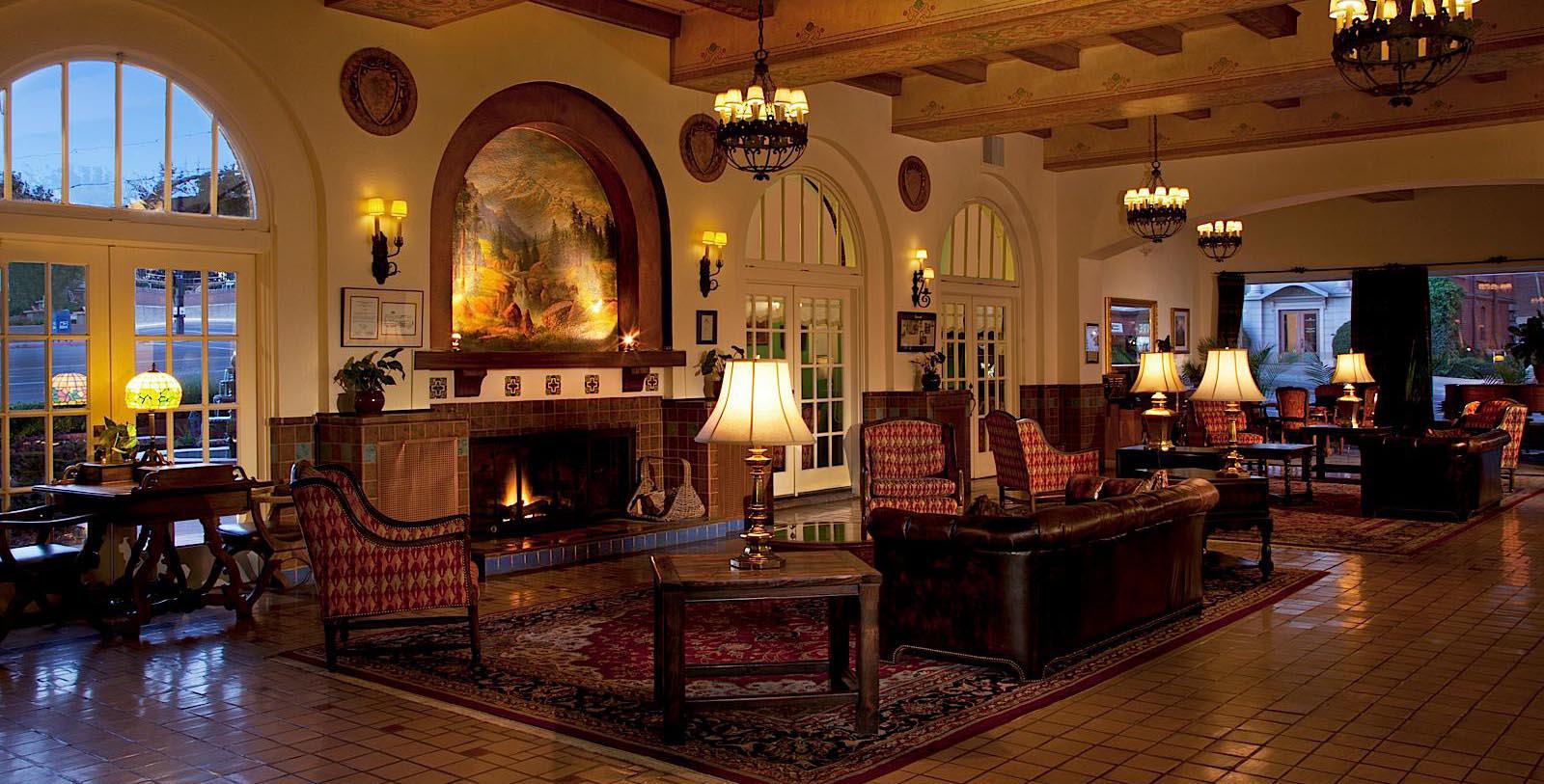 a room with a fireplace and couches