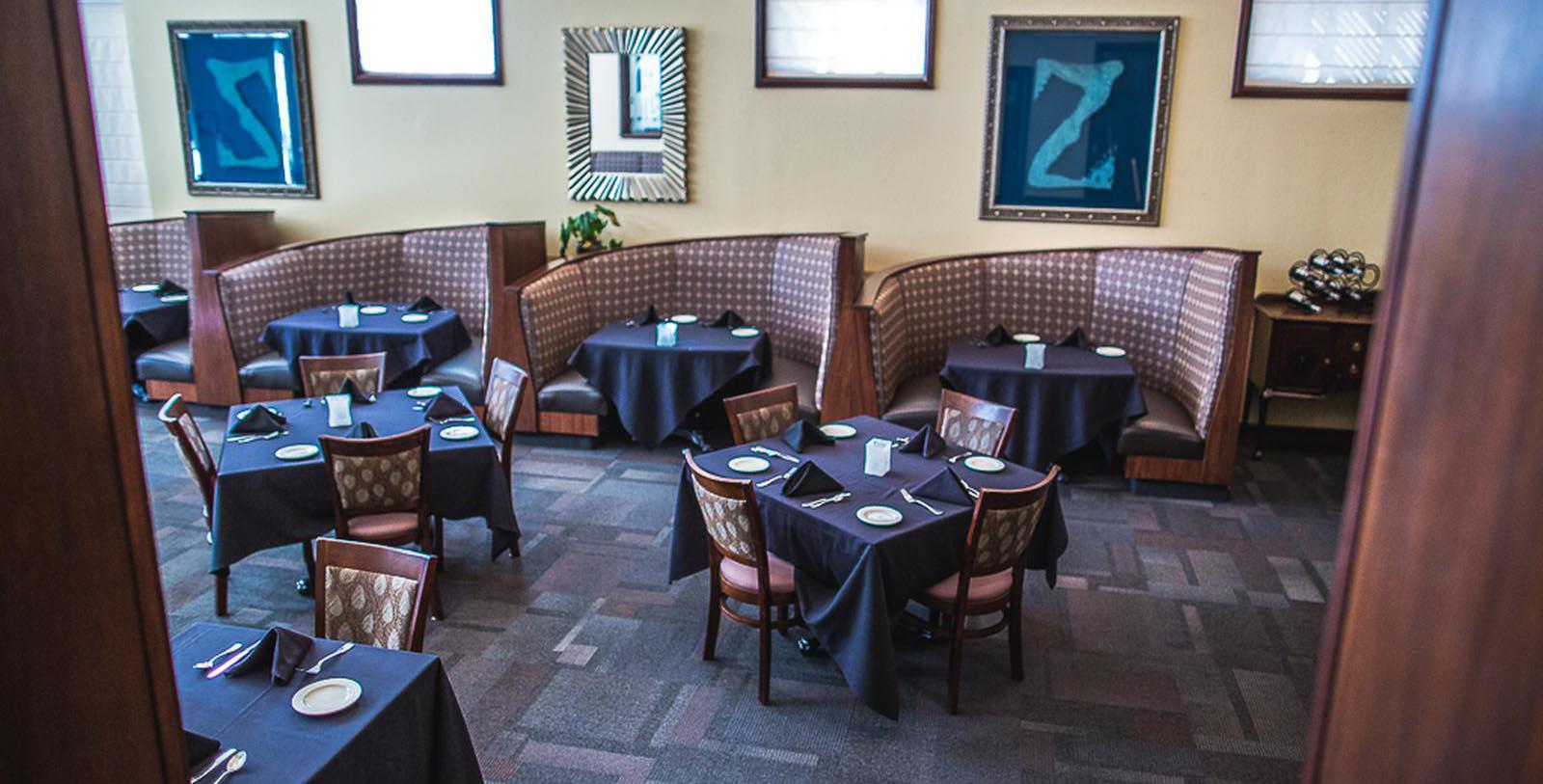 a restaurant with tables and chairs