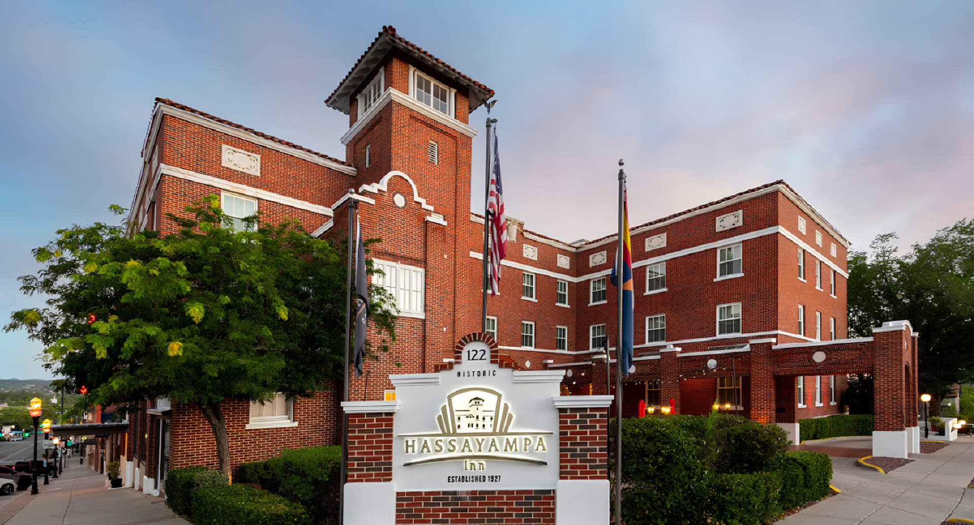 a sign in front of a brick building
