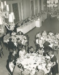 a group of people sitting at tables