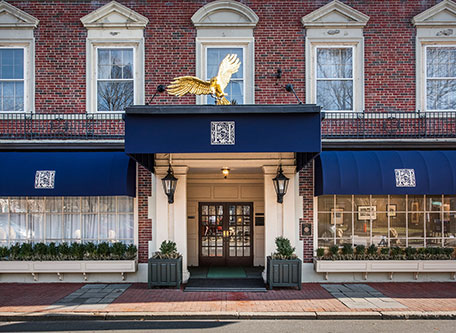 a building with a gold eagle statue on top of it