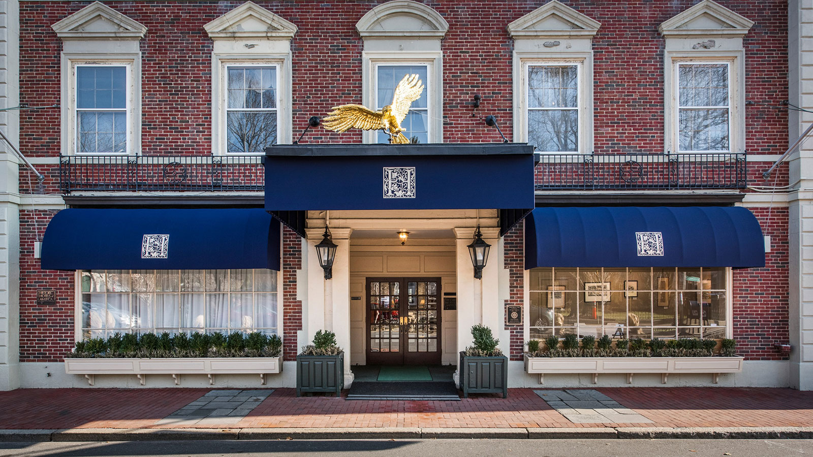 a building with a gold eagle statue on top of it