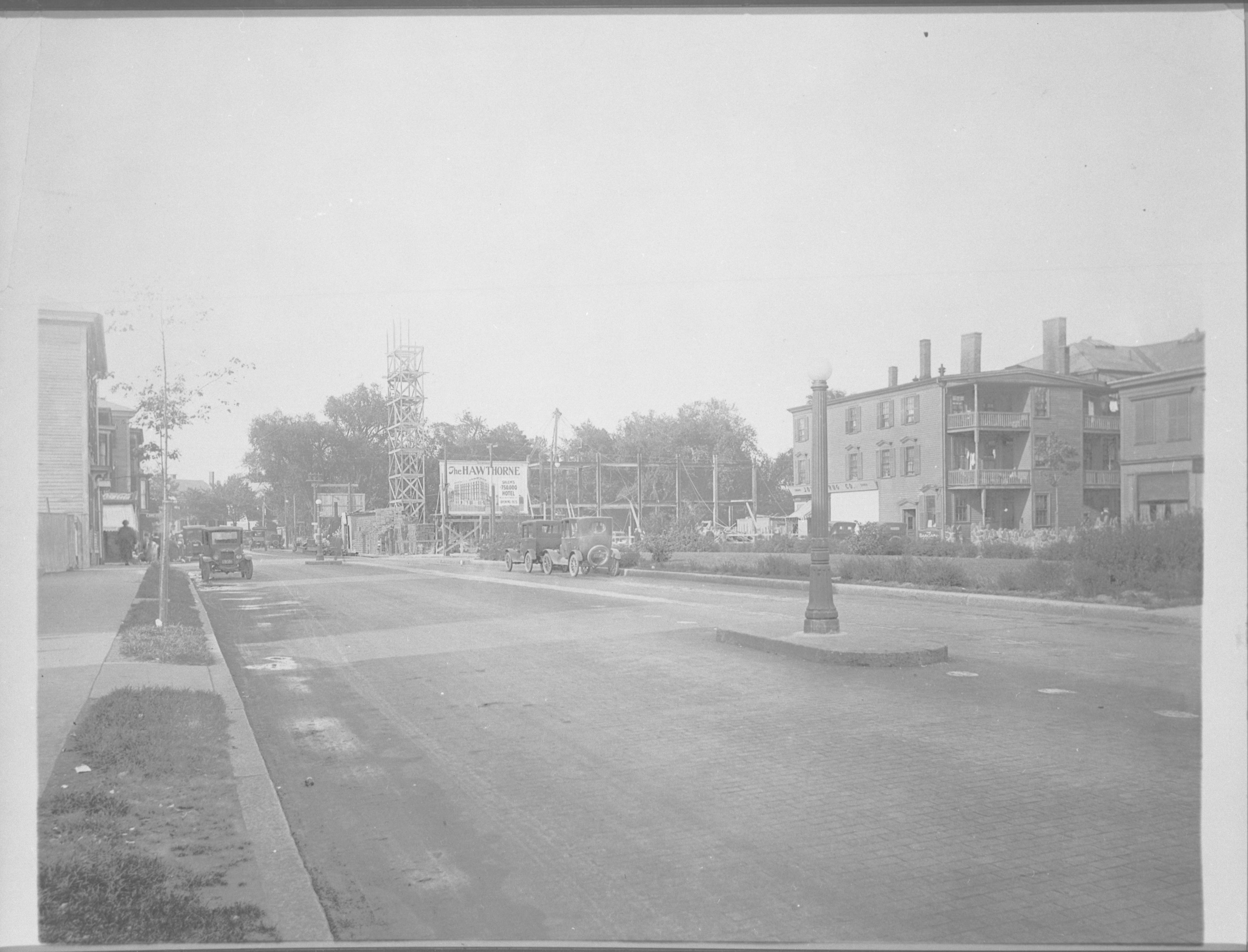 a street with cars and buildings