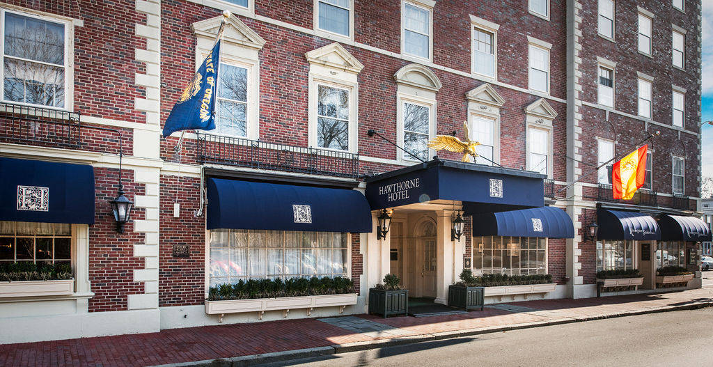 a building with blue awnings and flags
