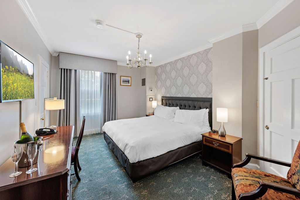 a room with a bed and a desk