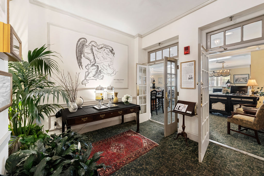 a room with a table and plants