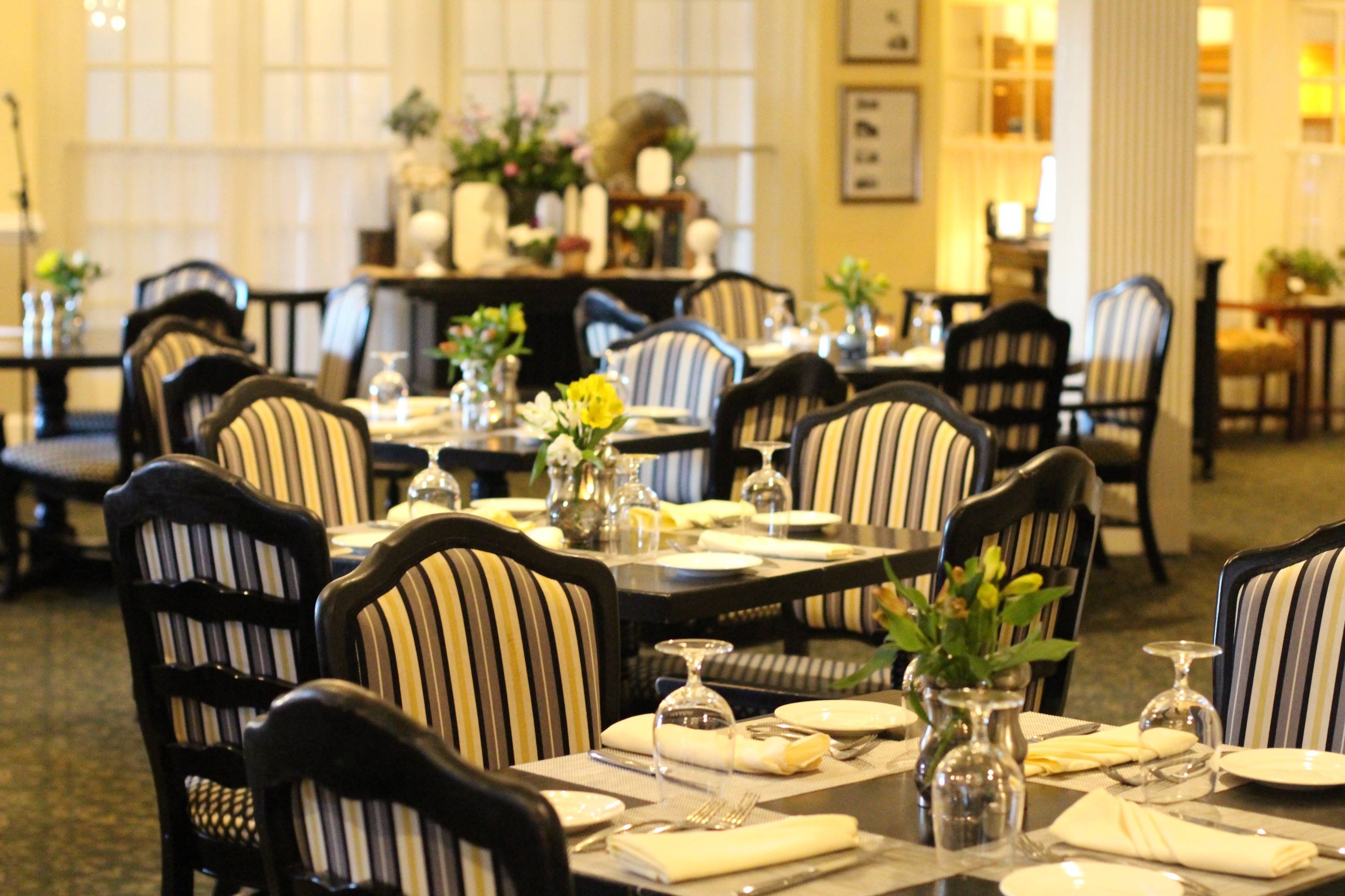 a restaurant with tables and chairs