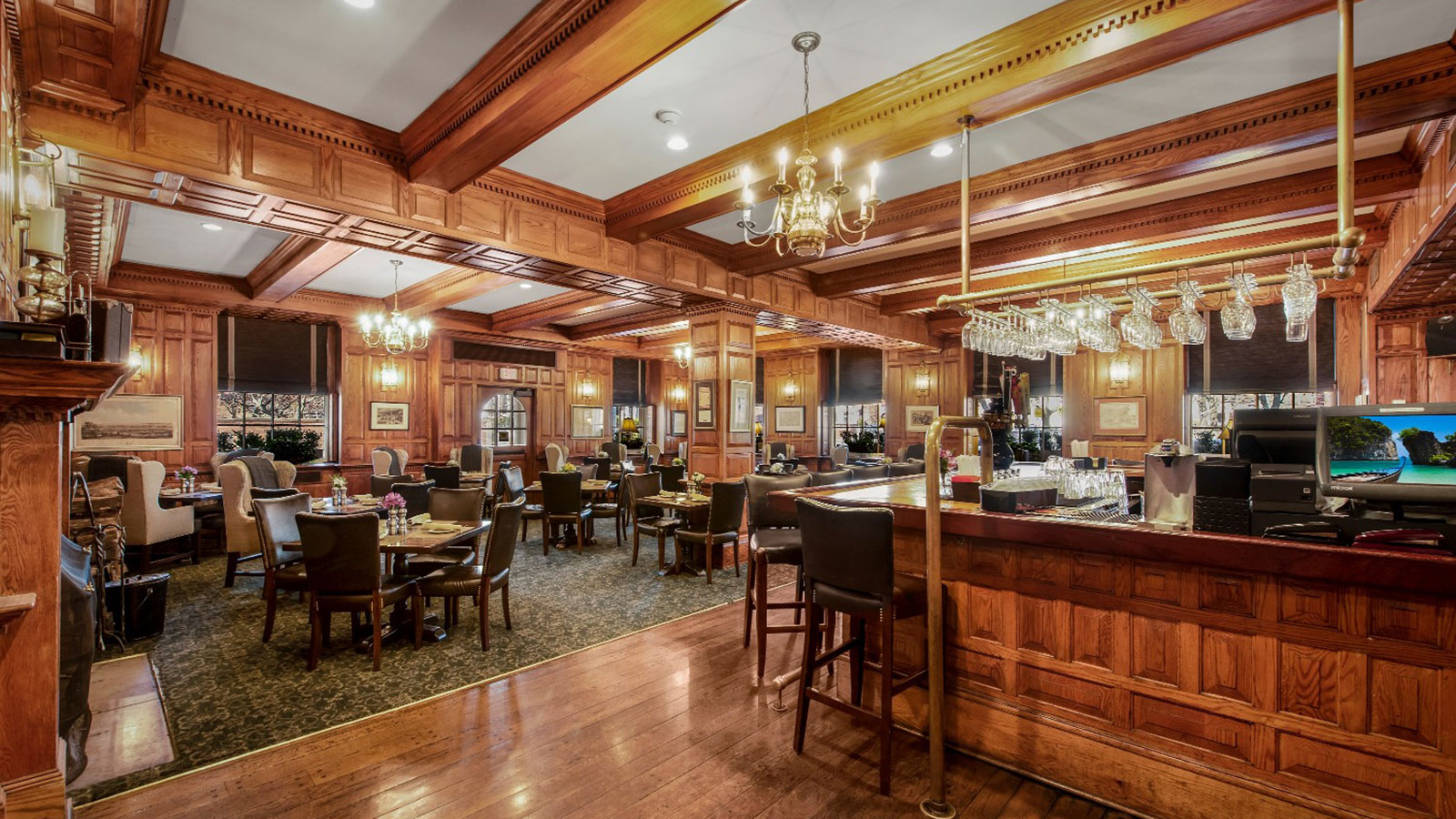 a room with a bar and chairs