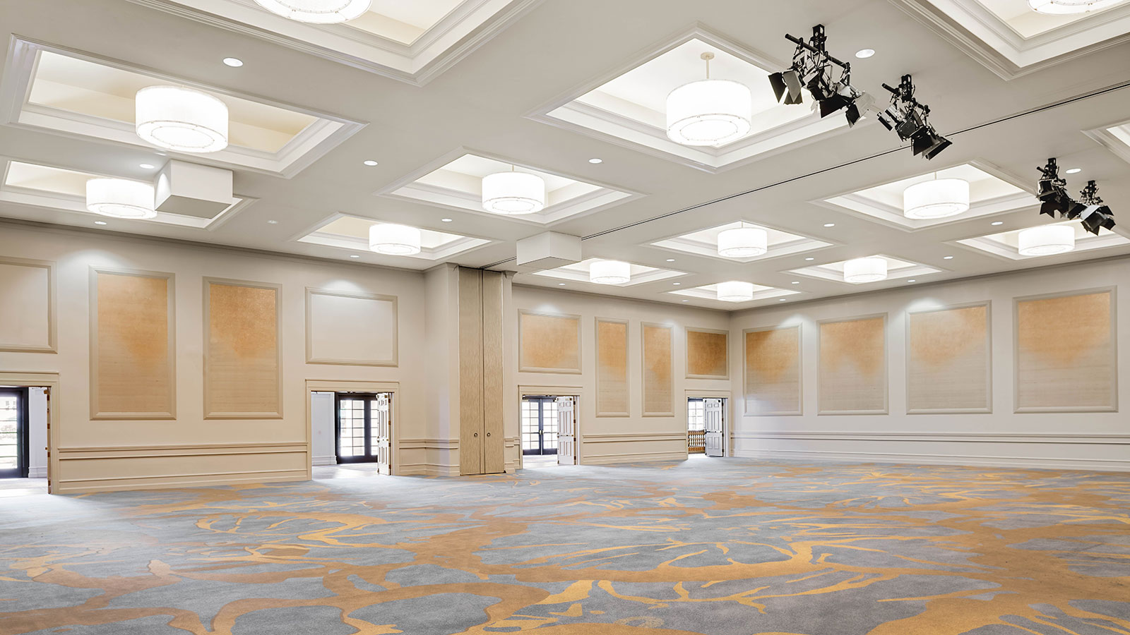 a large room with lights and a carpet