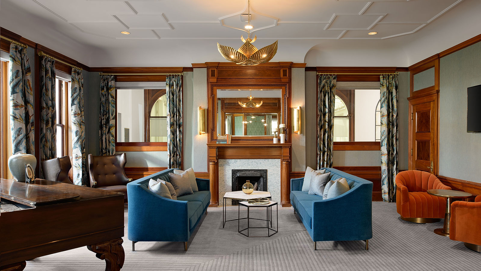 a room with blue couches and a fireplace
