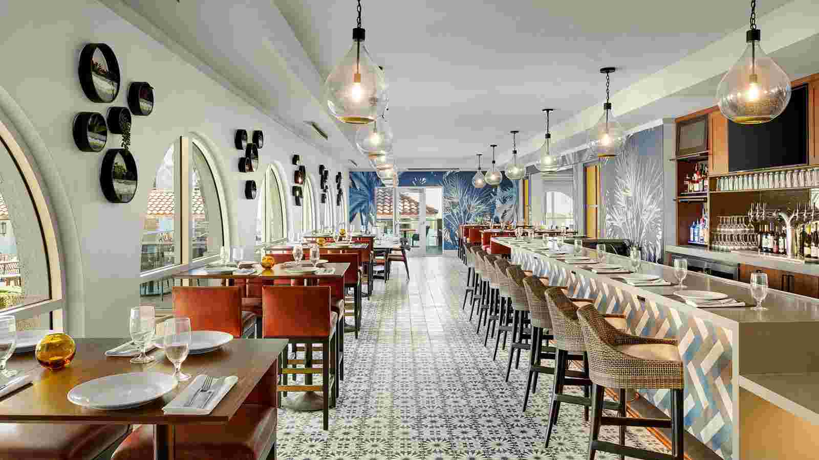 a long room with tables and chairs