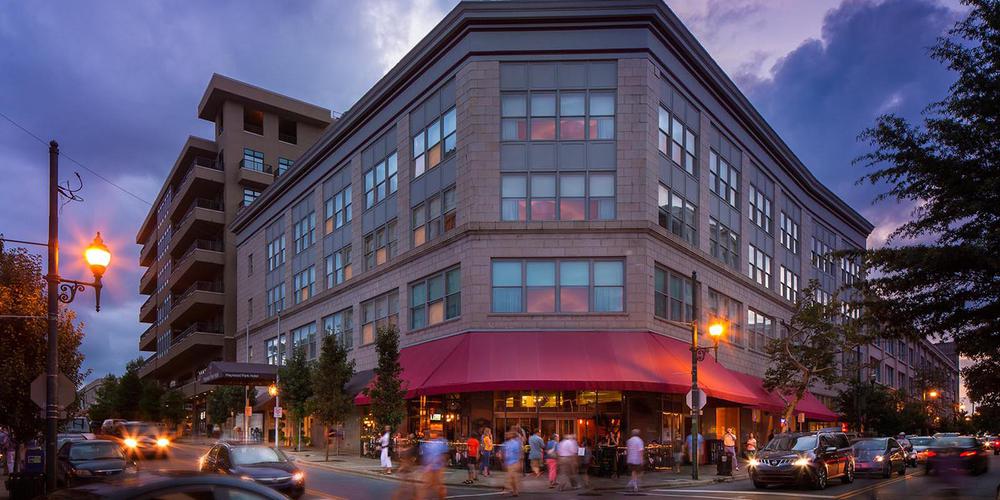 a building with people walking on the street