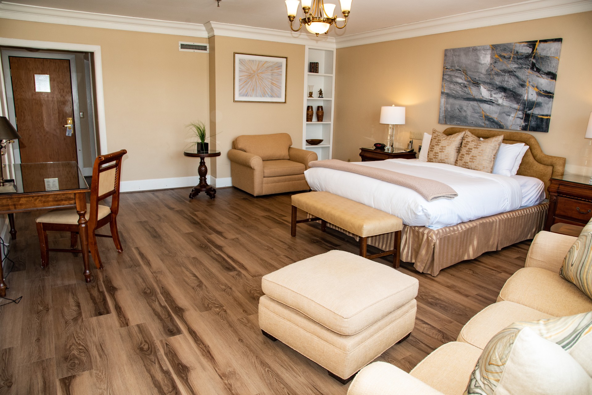 a bedroom with a bed and a chair