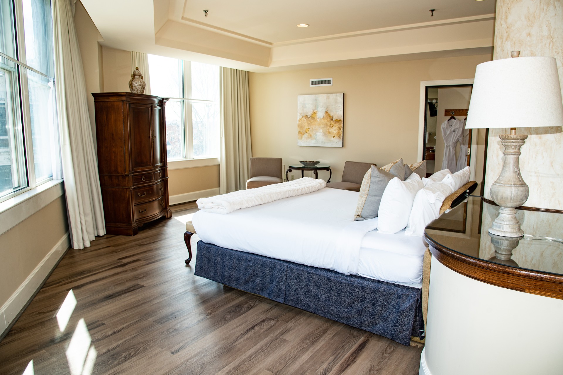 a room with a bed and a dresser