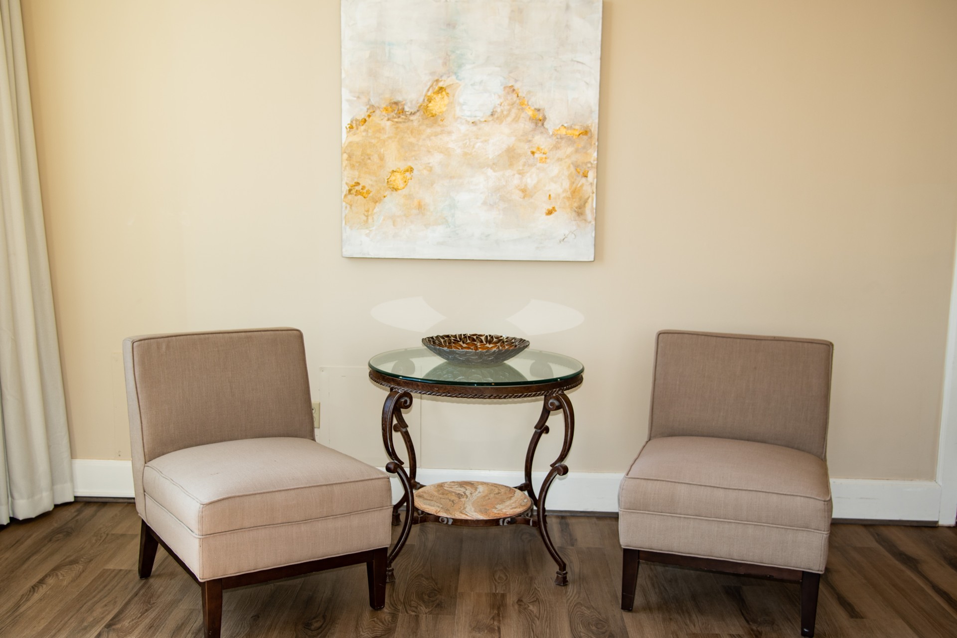 two chairs next to a table