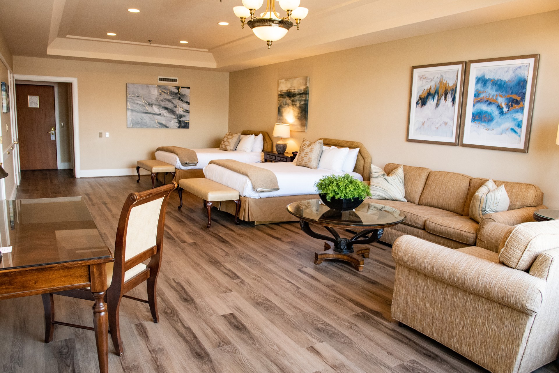 a room with two beds and a table