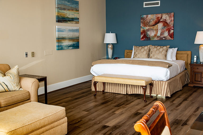 a bedroom with a bed and a couch