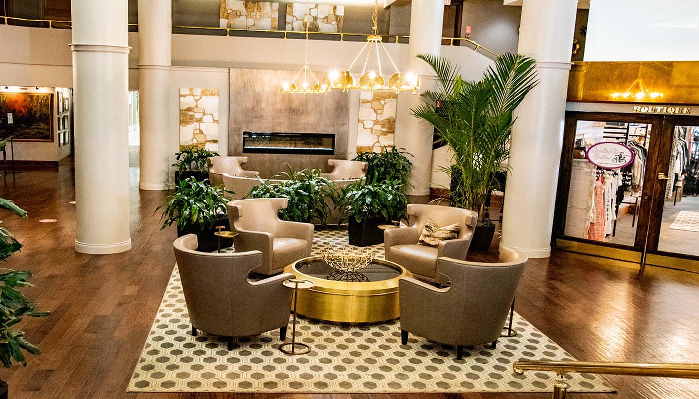 a room with chairs and a fireplace