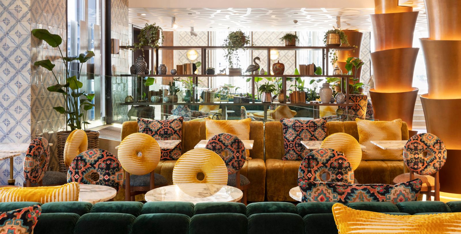 a room with a couch and tables
