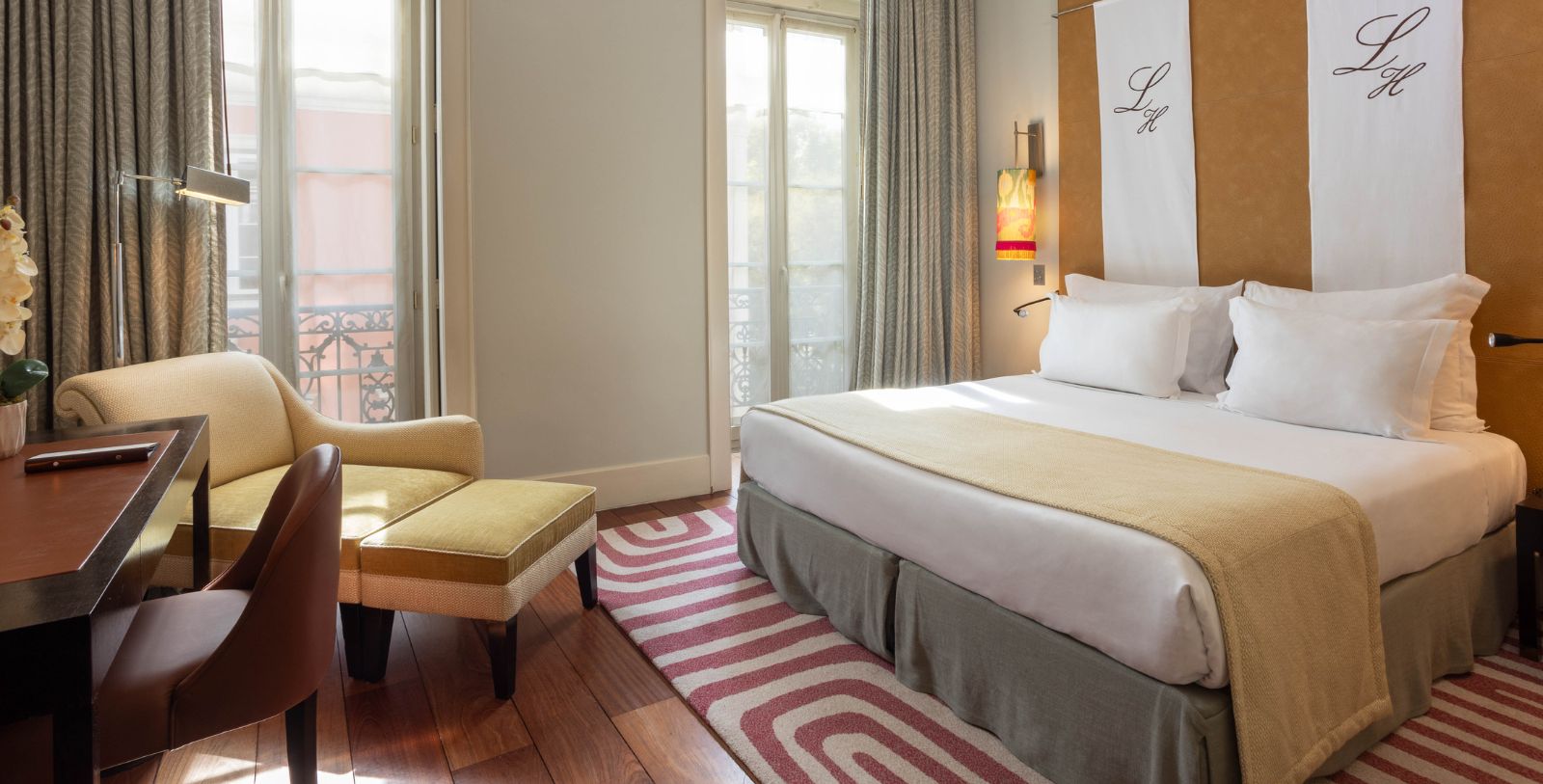 a bedroom with a bed and a chair