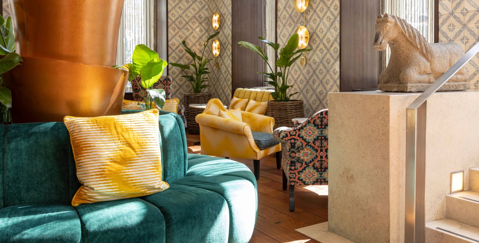 a room with a couch and chairs