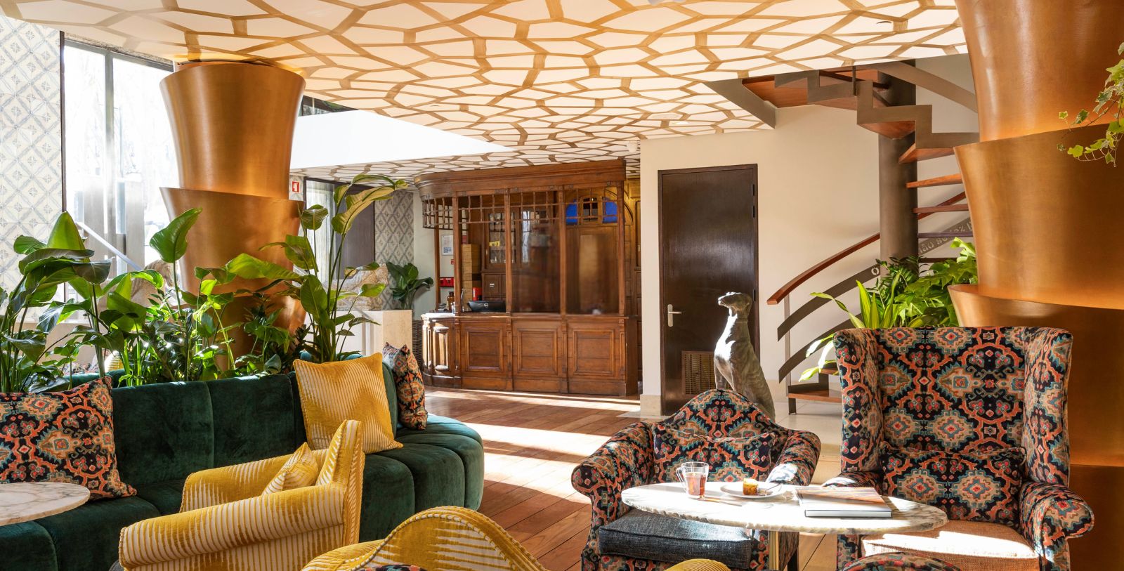 a room with a couch and chairs