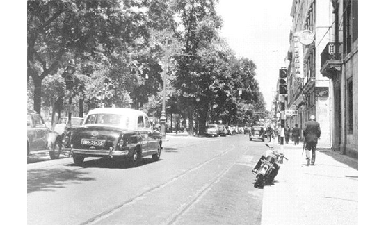 a black and white photo of a street
