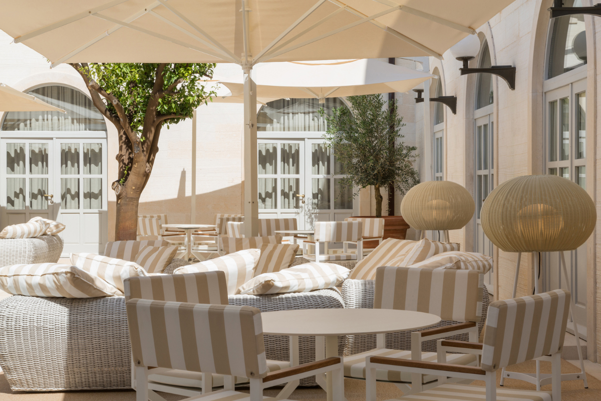 a patio with chairs and tables