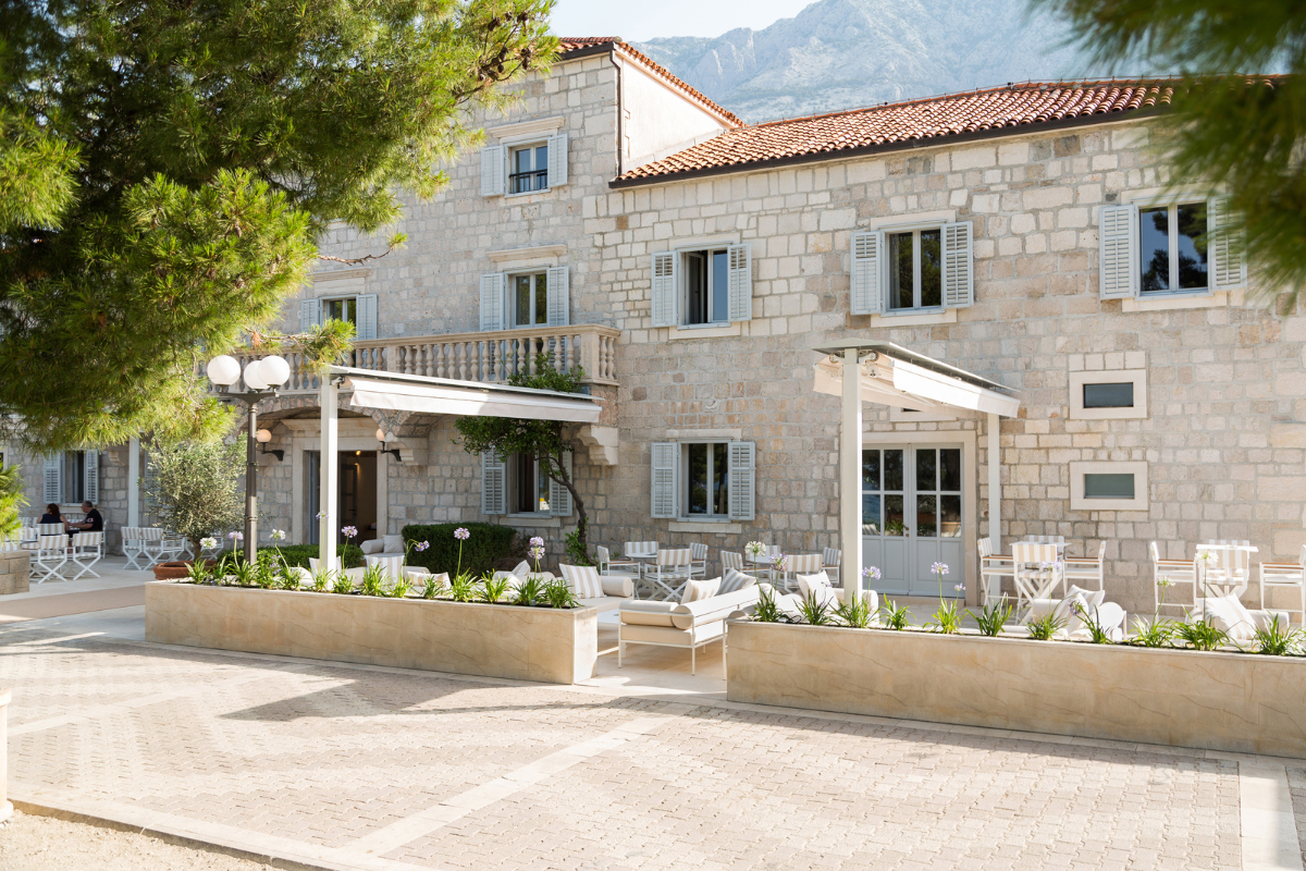 a building with a patio and chairs