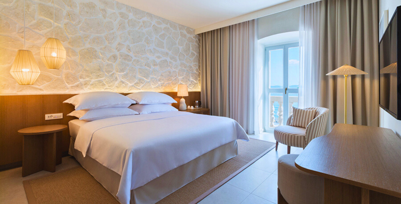 a room with a bed and a chair